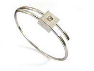 Edelstahl-Armspange mit Weißgoldener Fassung und Cut-Diamant