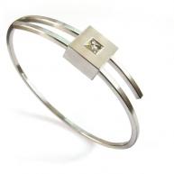 Edelstahl-Armspange mit Weißgoldener Fassung und Cut-Diamant